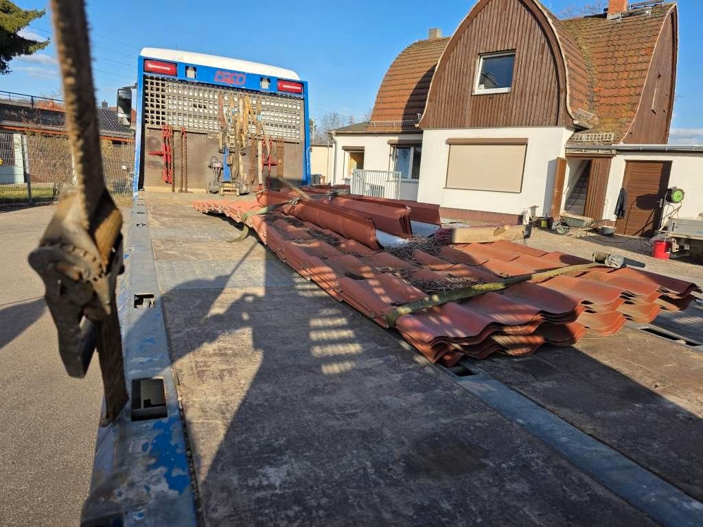 Fahrzeugabbildung MAN 26.400 TGX mit Baustoffplateau, geteilte Rampen