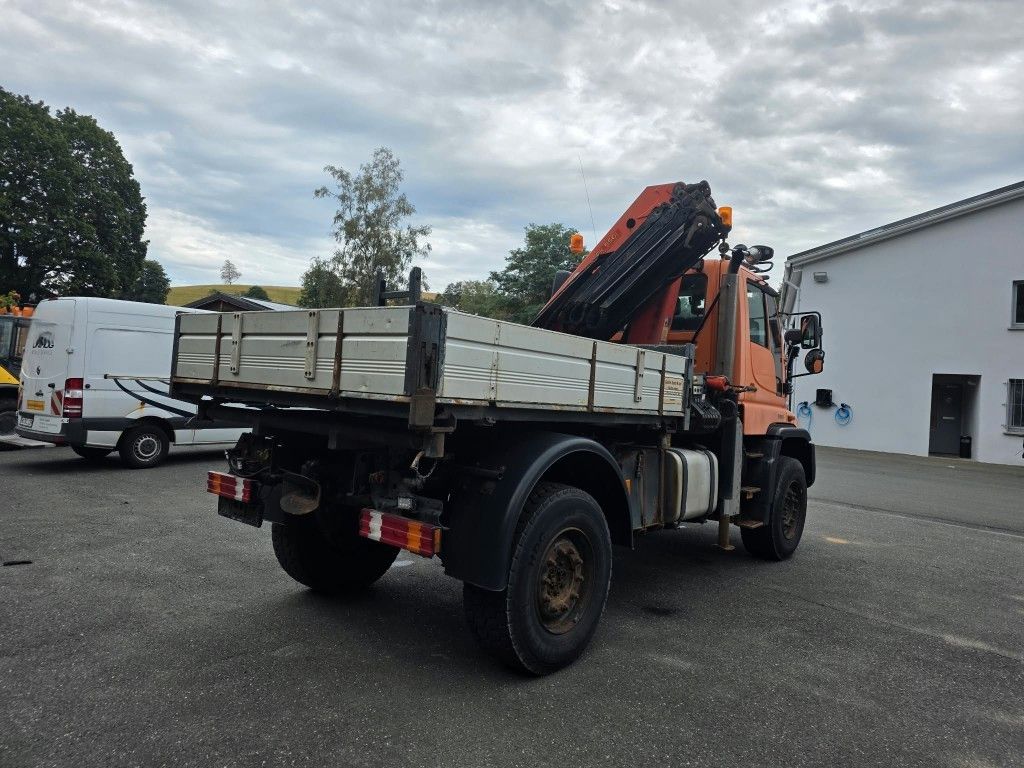 Fahrzeugabbildung Unimog U 500 3-Seiten-Kipper mit Kran PK 9501